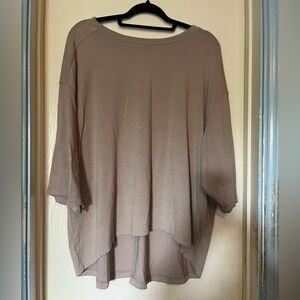Beautiful Beige High/Low Blouse. Mid length bat wing sleeves.